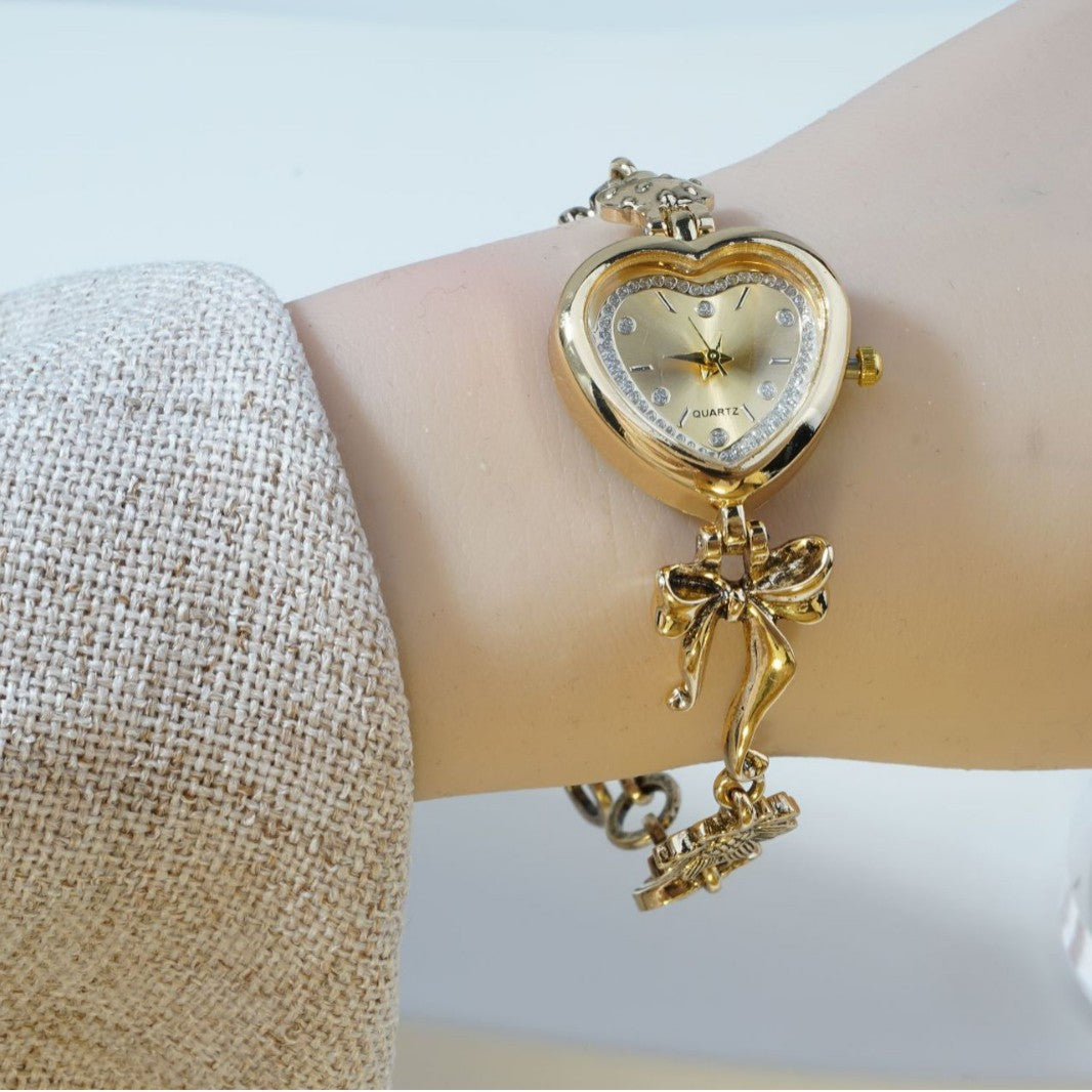 Retro Heart-shaped Bracelet Watch With A Golden Bow And Flower Design