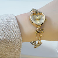 Retro Heart-shaped Bracelet Watch With A Golden Bow And Flower Design A Stylish Womens Timepiece