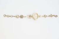 Retro Heart-shaped Bracelet Watch With A Golden Bow And Flower Design A Stylish Womens Timepiece